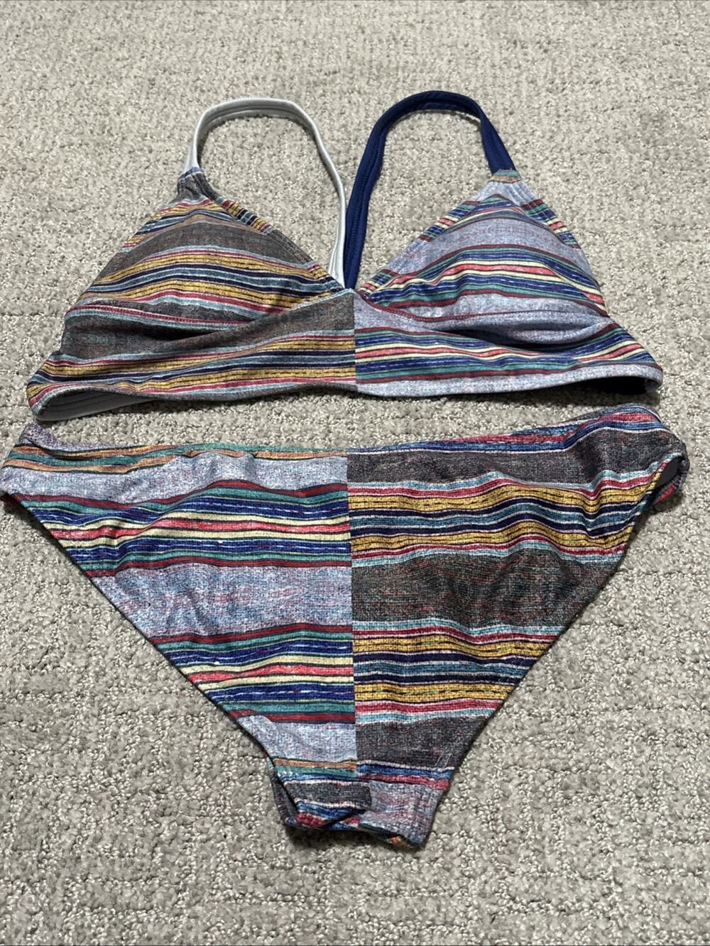 Niyama Sol bikini set with a multi-colored striped pattern